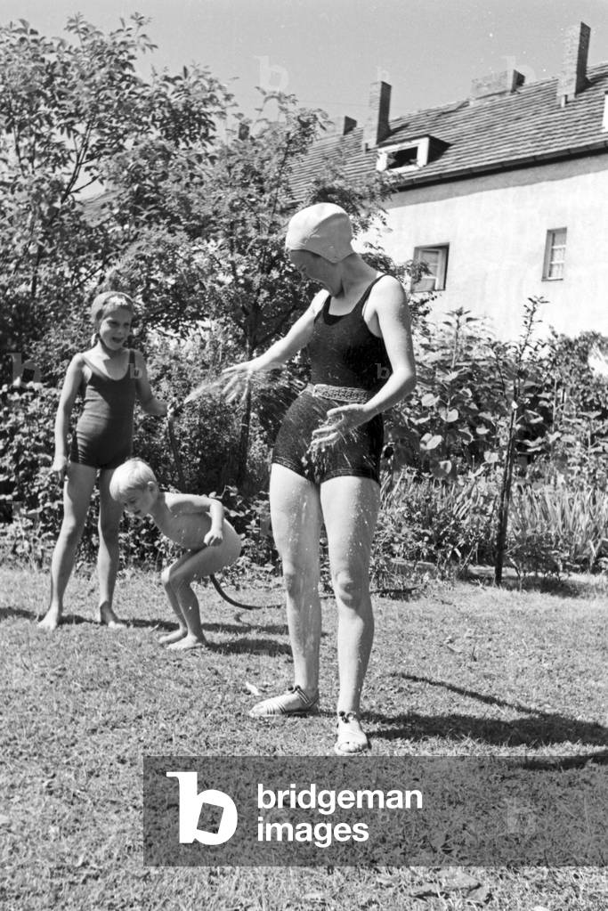 A family in their garden, Germany 1930s (b/w photo)