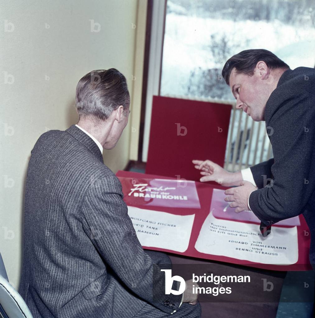 German journalist and TV presenter Eduard Zimmermann planning the front credits of a coverage, mid 1960s