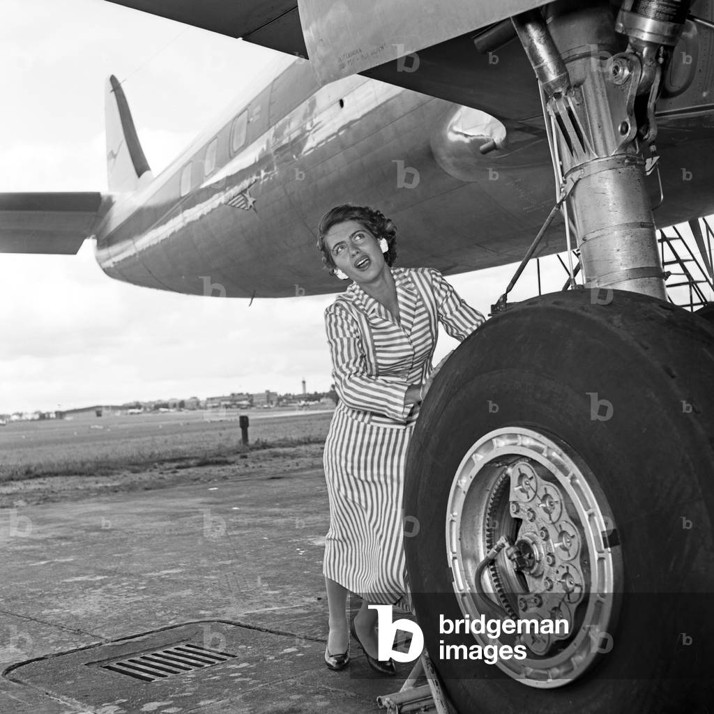 Well known trying to push a plane, Germany 1950s