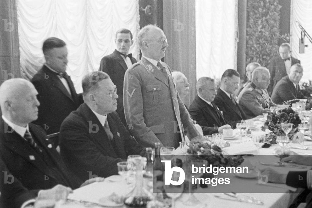 Speaker at the banquet after the Diesel anniversary ceremonial act at the MAN factory at Augsburg, Germany 1930s (b/w photo)