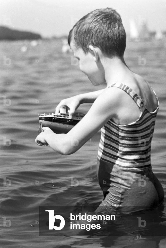 Little boy at lake Wannsee lido in Berlin, Germany 1930s (b/w photo)