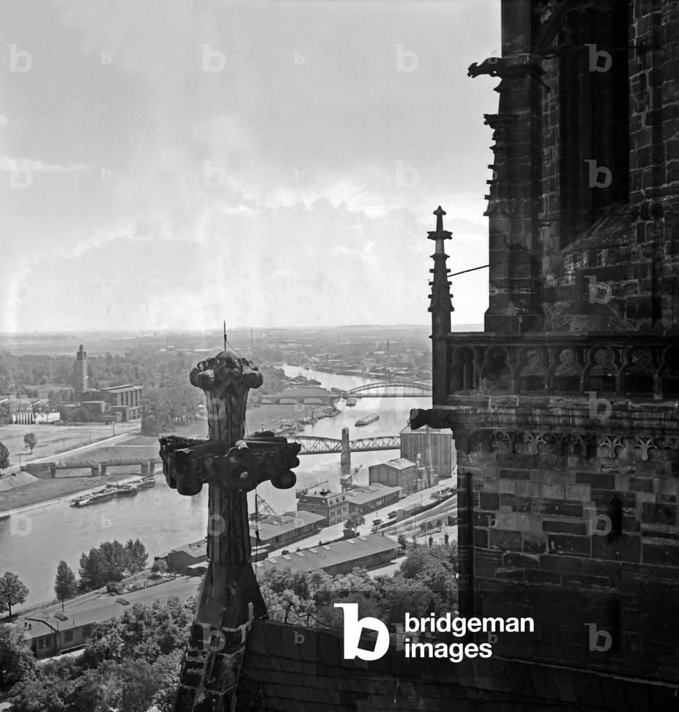 View from the belfry of the Magdeburg cathedral to the city and the industry and harbor at the river Elbe, Germany 1930s (b/w photo)