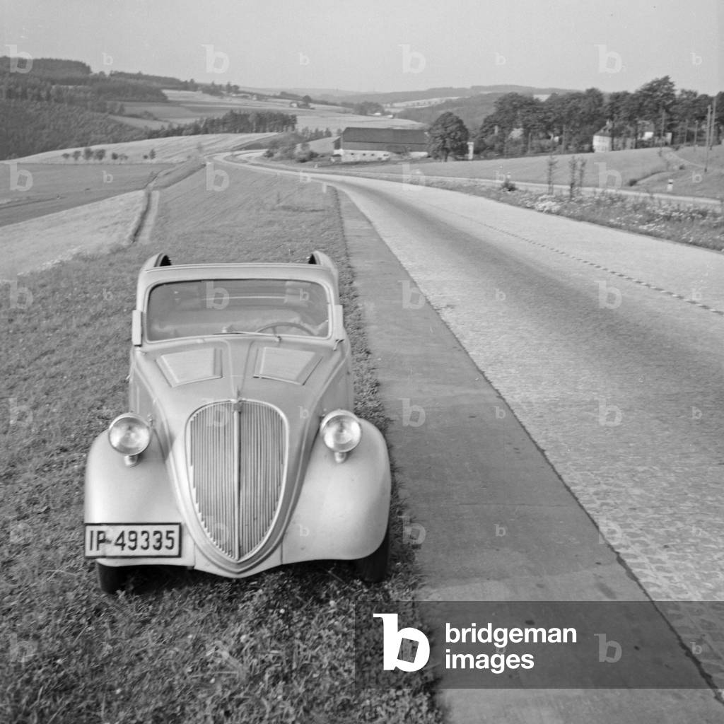 Resting by a country road in the Black Forest area, Germany 1930s (b/w photo)