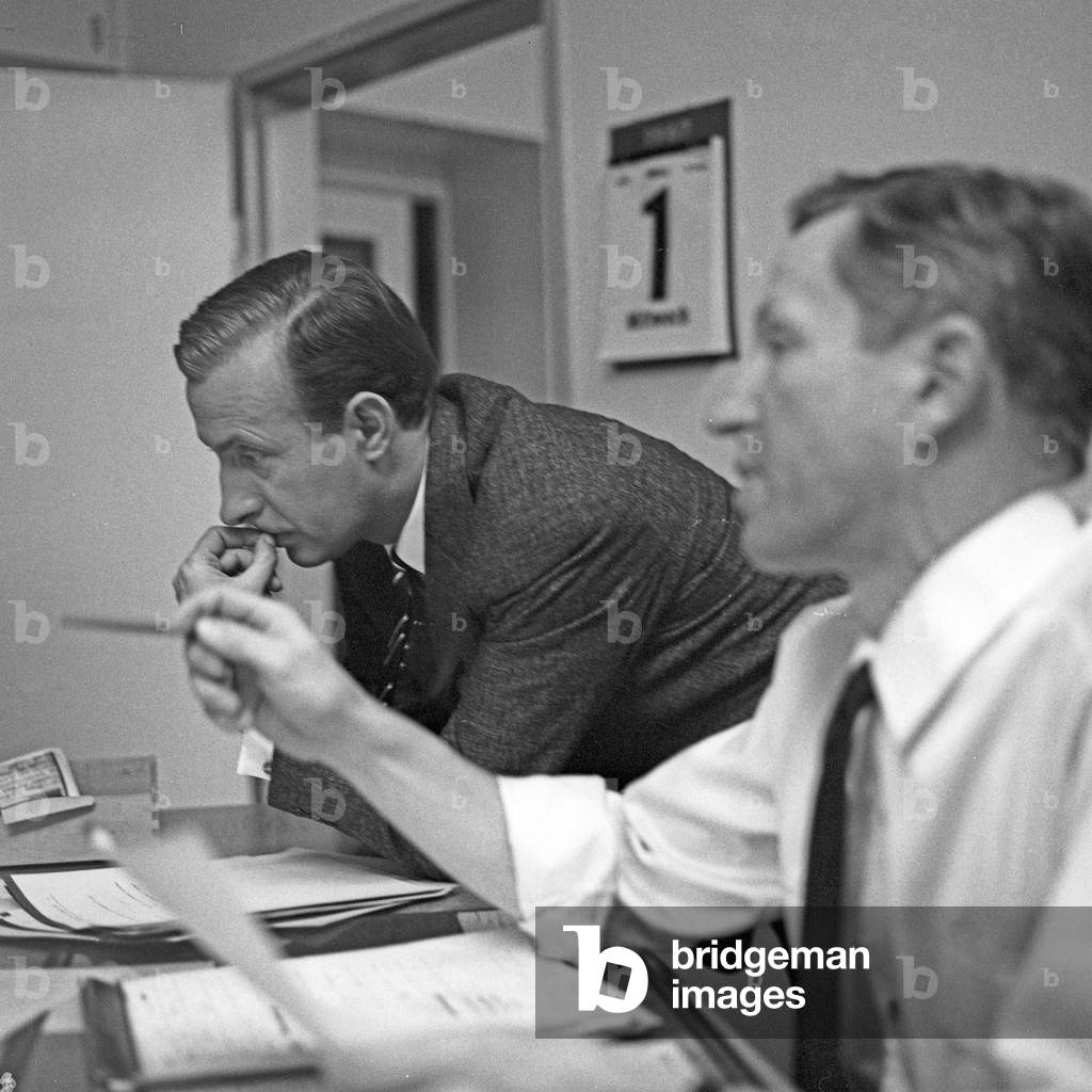 German news presenter Karl Heinz Koepcke (left) at editor's office of news show 