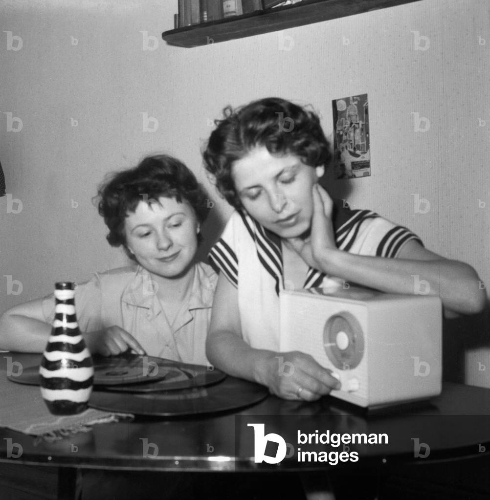 Two young women with records and their radio, Germany 1950s