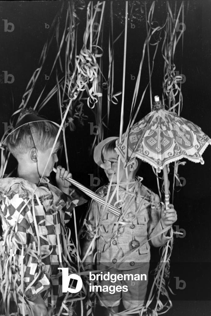Two little boys dressed for a carnival, Germany 1930s (b/w photo)