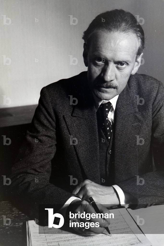 Portrait of one of the Diehl brothers and founders of the hedgehog character Mickie working on the skript of the animated movie The Race between the Rabbit and the Hedgehog, Germany 1930s (b/w photo)
