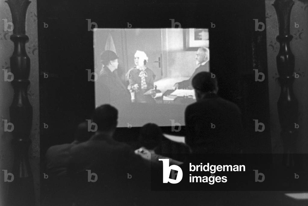 Staff member of a meteorological office watching a movie, Germany 1930s (b/w photo)