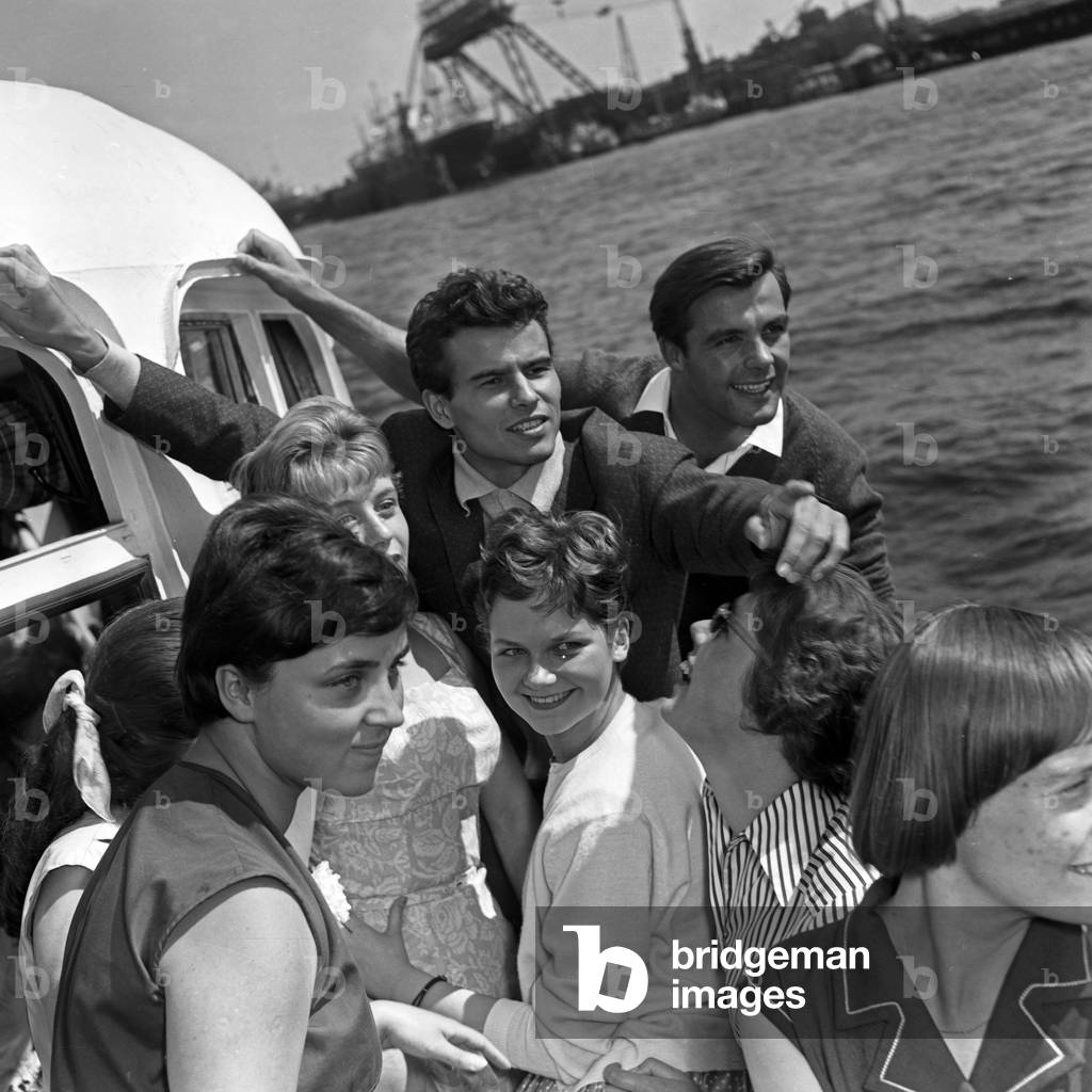 German actor Horst Buchholz and Austrian ski racer Toni Sailer on a ship at Hamburg, Germany 1950s