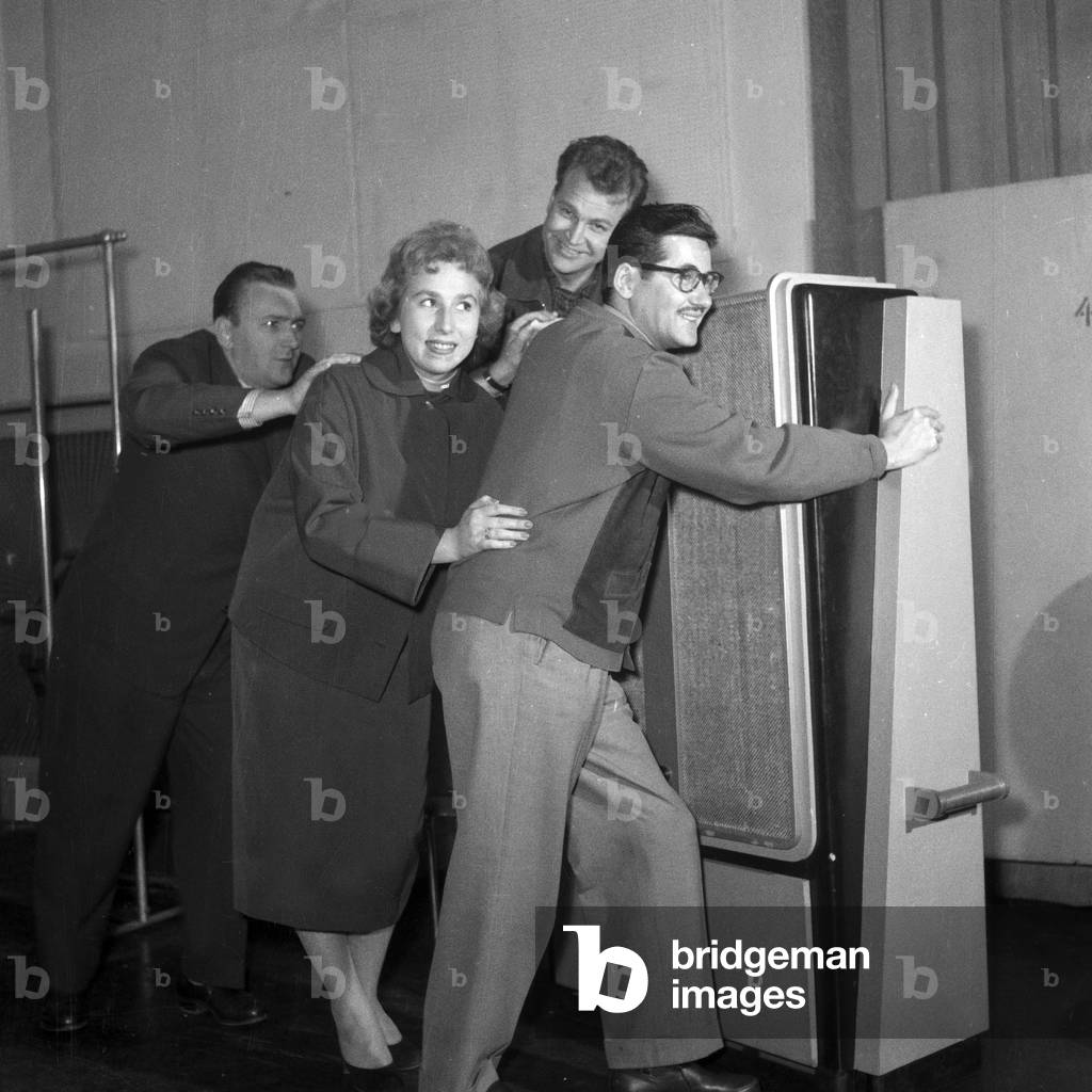Staff of German TV station NWDR being silly at the floor of the building in Hamburg 1954