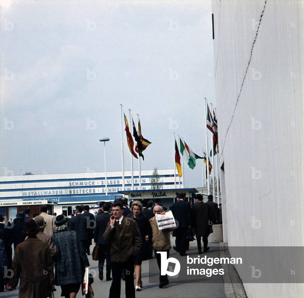 Visitors and customers walking over the Hanover trade fair in 1964