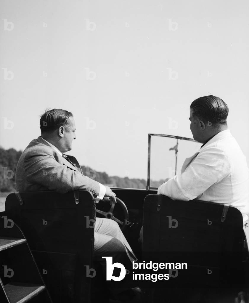 A man on a lake in his motor boar, Germany 1930s (b/w photo)