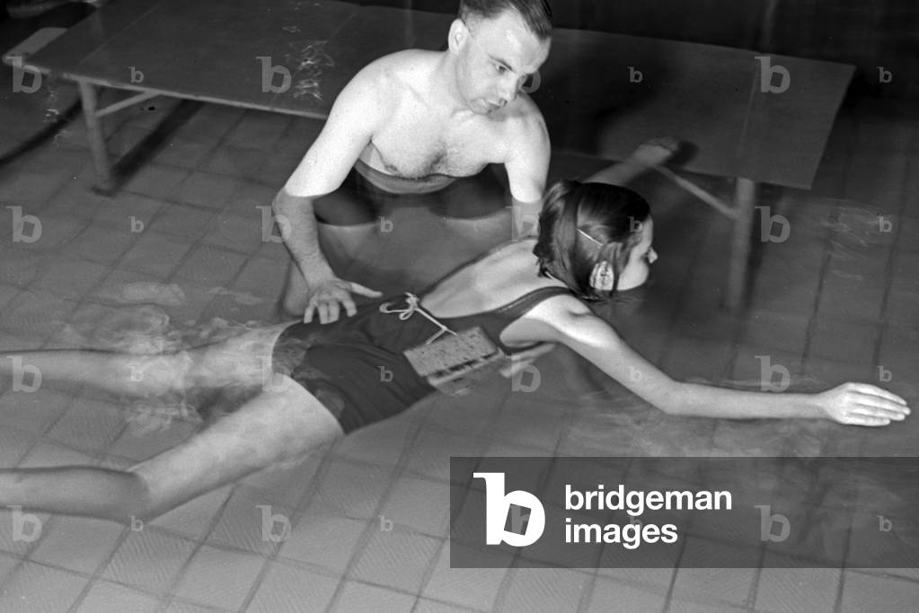 A female patient in a therapeutic bath, Germany 1930s (b/w photo)