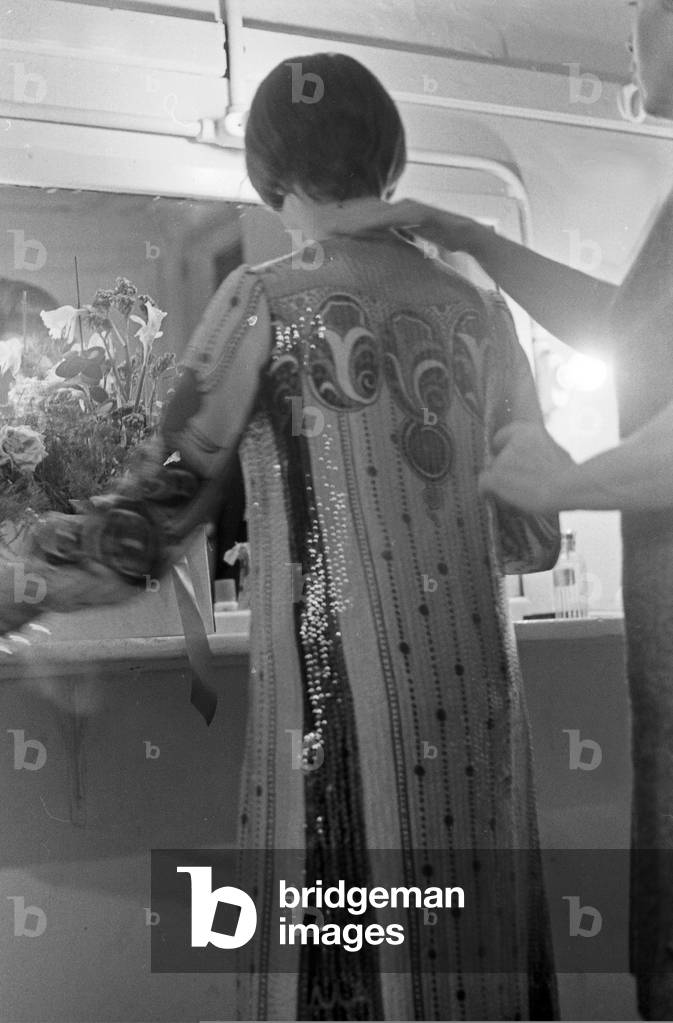 French singer Mireille Mathieu in her wardrobe for a concert at Hamburg, Germany early 1970s