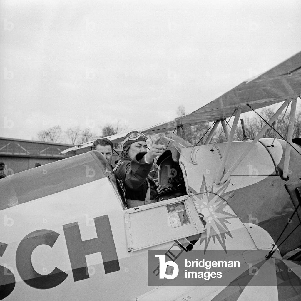 German stunt pilot Albert Falderbaum in his Buecker Bue 133 biplane, Germany 1960s