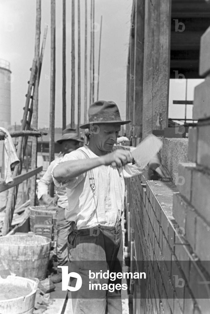 A bricklayer working, Witten, Germany 1930s (b/w photo)