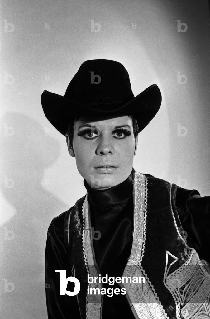 Model Petra posing as a cowboy for German TV magazine 