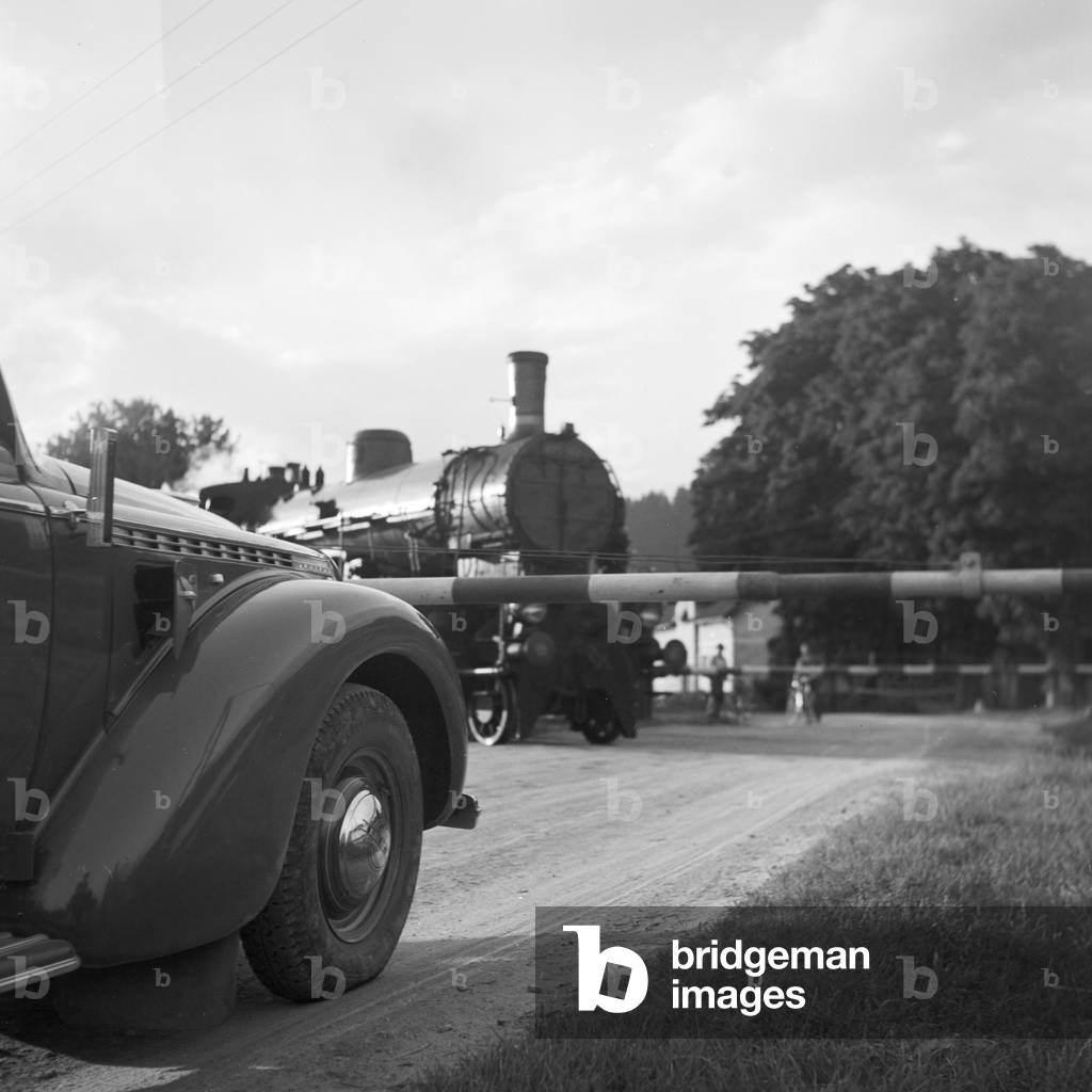 On the road with an Opel model Olympia at the Wachau area in Austria, Germany 1930s (b/w photo)
