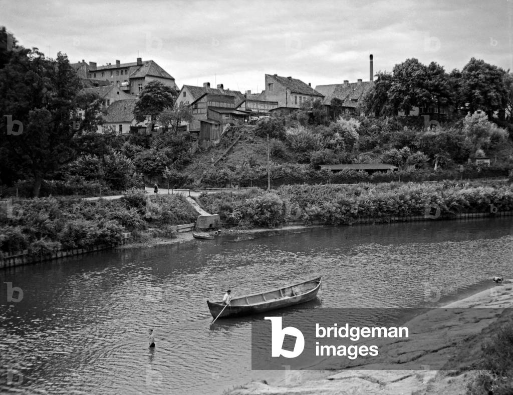 At the river Inster flowing through Insterburg, East Prussia, 1930s (b/w photo)