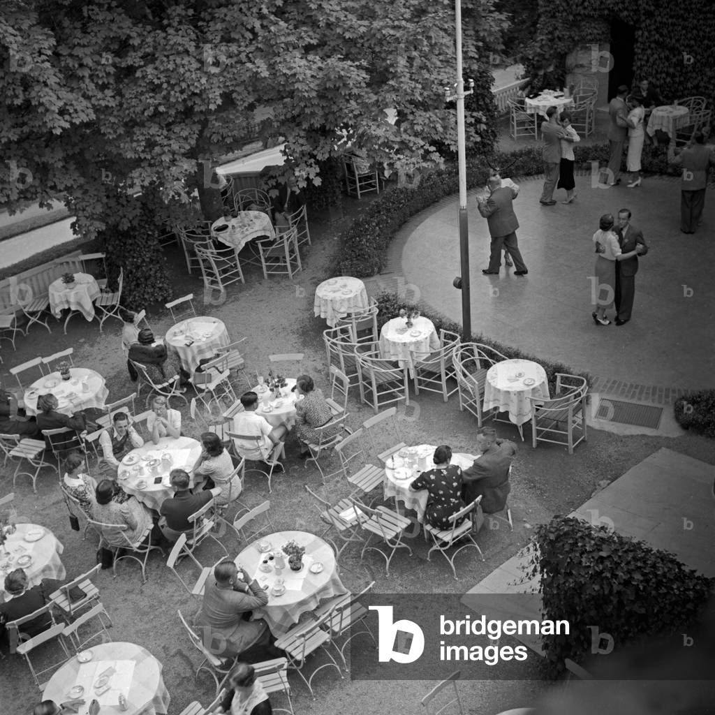 Tables of an outdoor gastronomy and dancefloor at Wildbad in Black Forest, Germany 1930s (b/w photo)