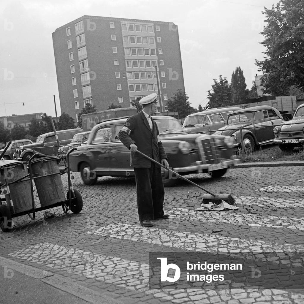 Men of the public street cleaning on the streets of Hamburg, Germany 1960s