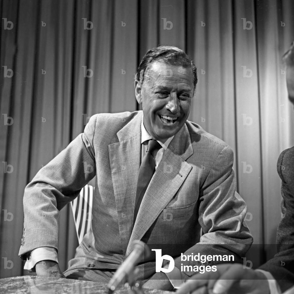 German actor Hans Soehnker laughing in an interview at Hamburg, Germany 1950s