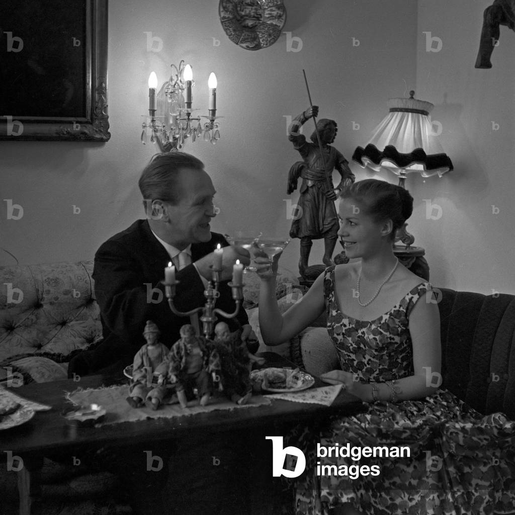 German actor Herbert A. E. Boehme and Ingrid Steen on new year's eve, Germany 1950s