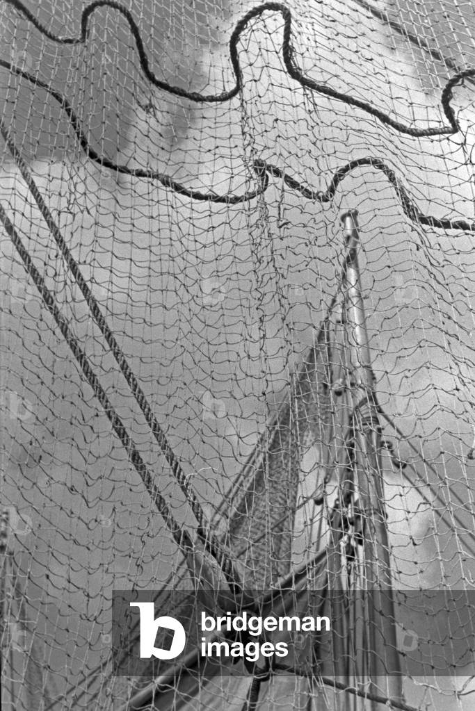 Fishing nets in a fishing boat at the harbor, Germany 1930s (b/w photo)