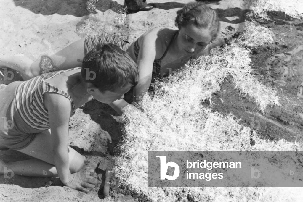 Mother and son at lake Wannsee lido in Berlin, Germany 1930s (b/w photo)