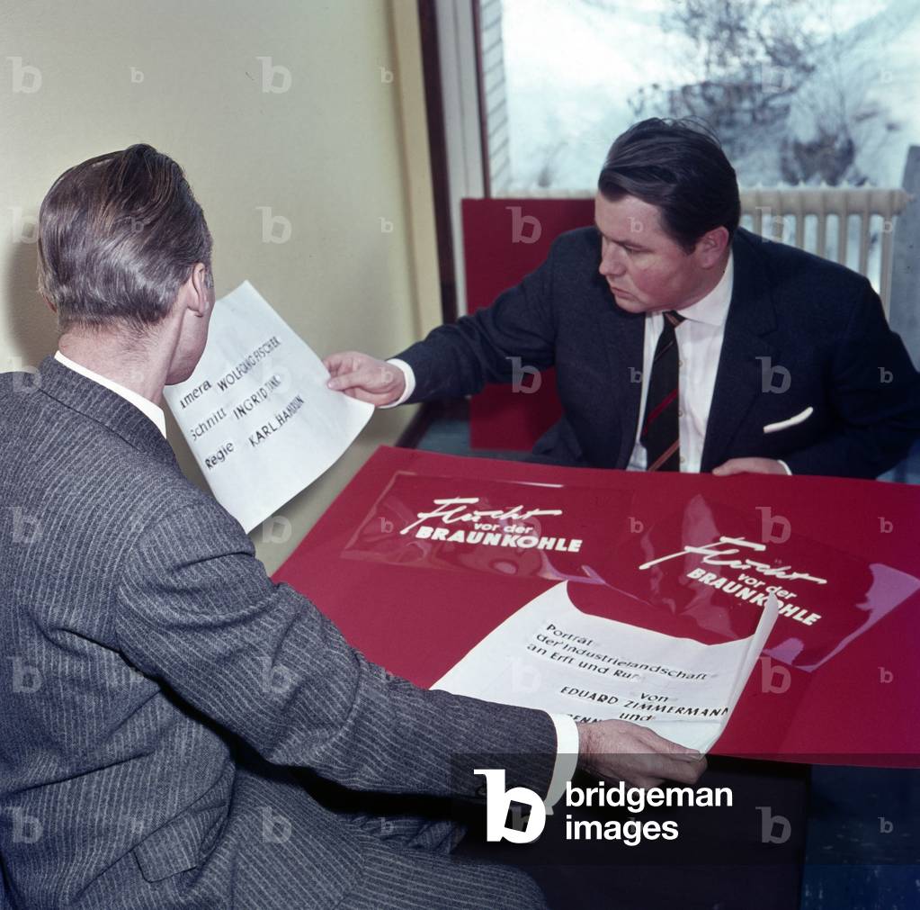 German journalist and TV presenter Eduard Zimmermann planning the front credits of a coverage, mid 1960s
