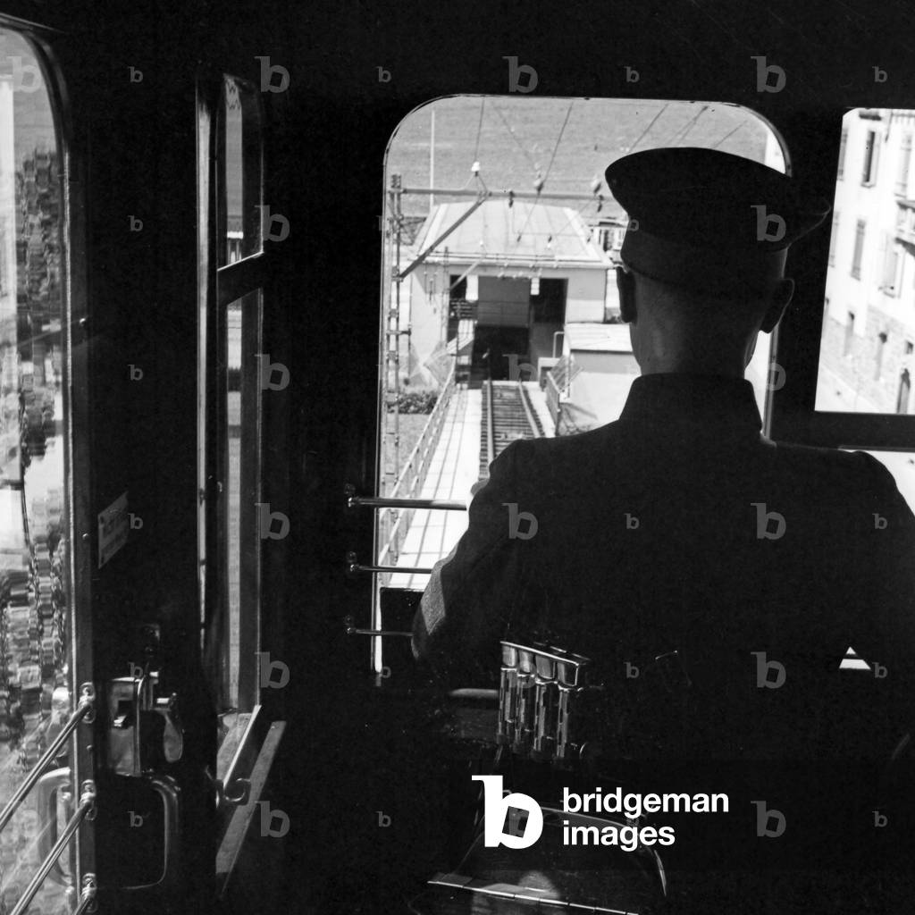 Driver of the Stuttgart cog railway at his cab, Germany 1930s (b/w photo)