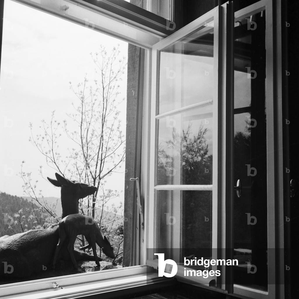 Dee scultpure in front of a window of spa resort at Buehlerhohe in the Black Forest region, Germany 1930s (b/w photo)