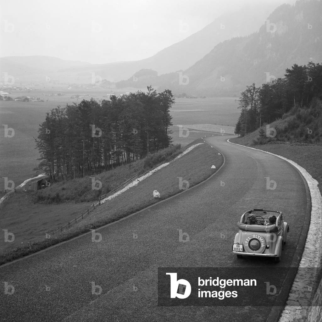 On the road in an Opel model Olympia, Germany 1930s (b/w photo)