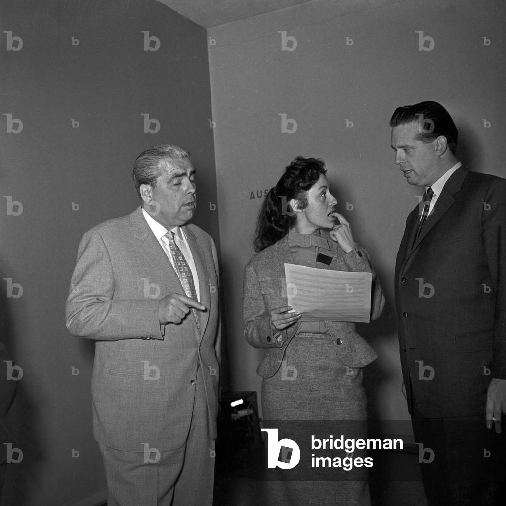 Singer Caterina Valente talking to managers of German TV and radio station NDR at Hamburg, Germany 1950s