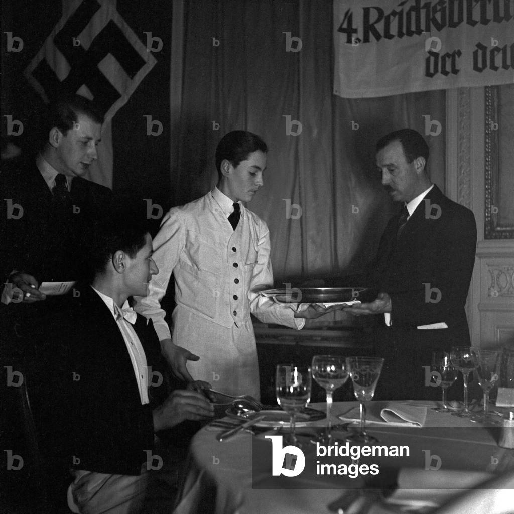 A waiter is examined at the Reichsberufswettkampf contest 1937, Germany 1930s