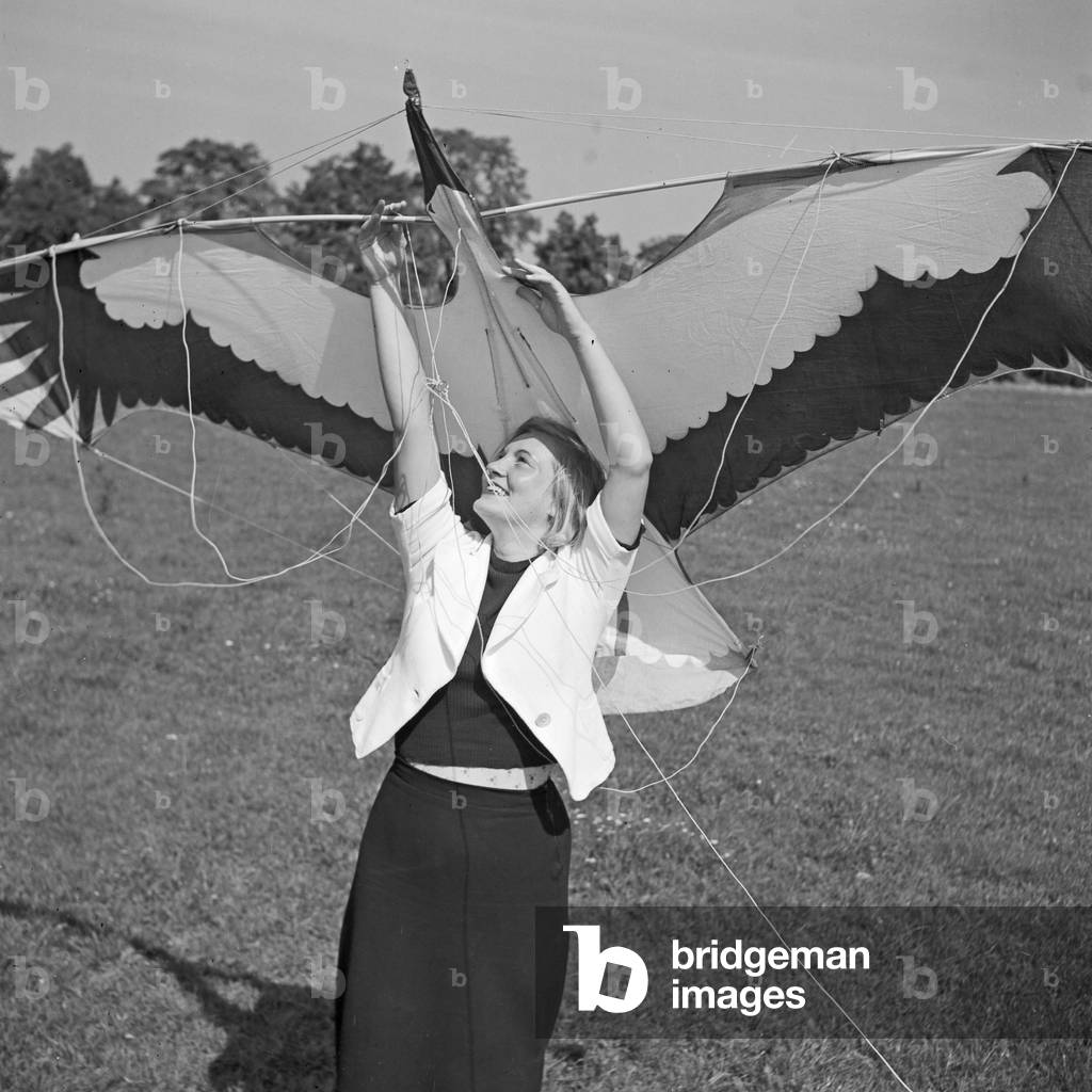 A young woman with a stunt kite, Germany 1930s (b/w photo)