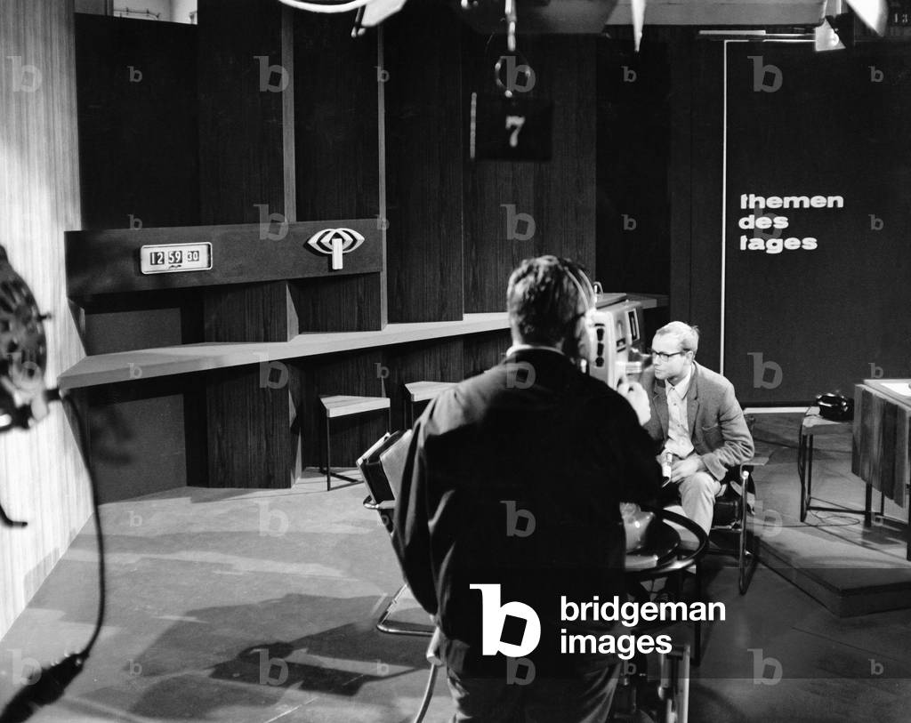 The director watching the schedule of a news show in German TV, ca 1967