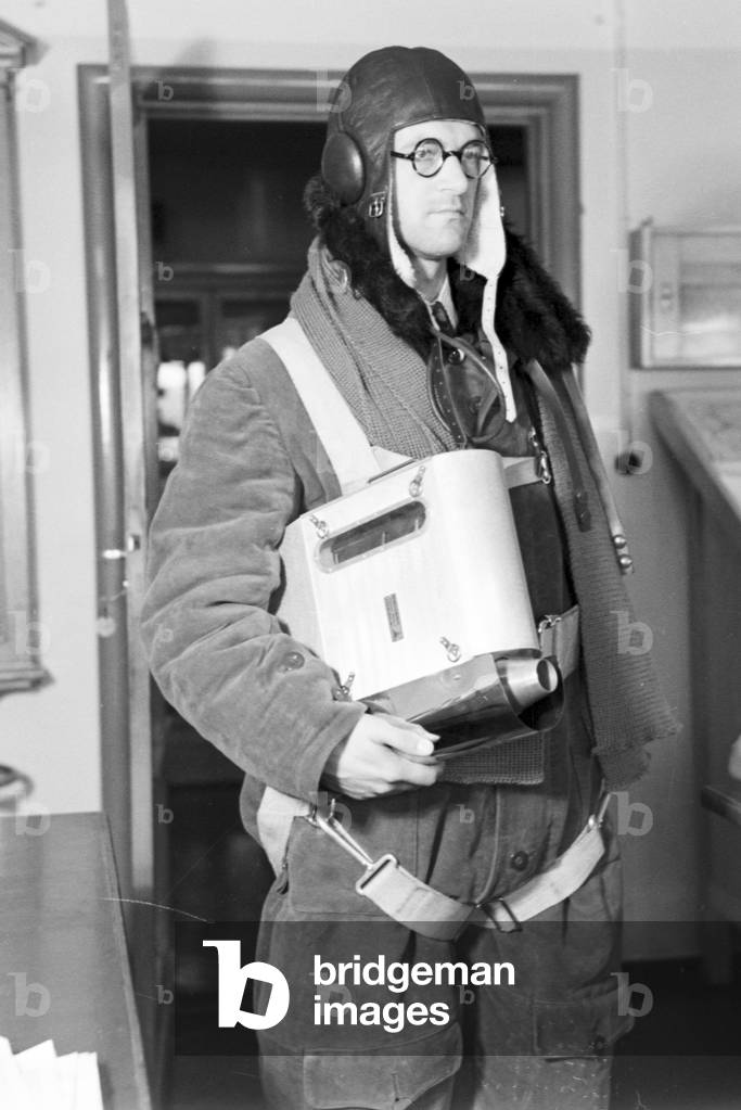 Staff member of a meteorological office before measuring the rainfall, Germany 1930s (b/w photo)