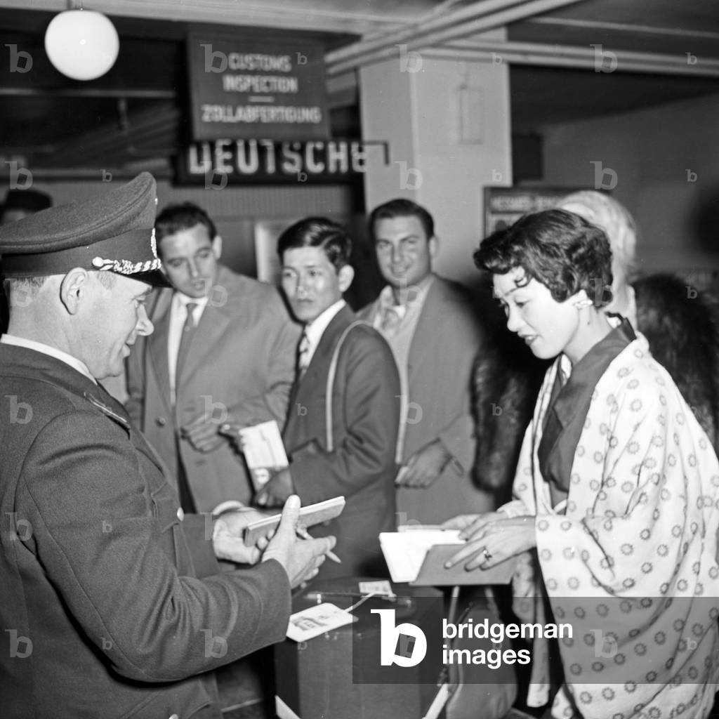 Female Japanese singer Butterfly arrives at Hamburg airport, Germany 1950s