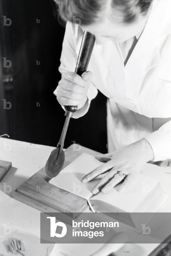A bookbinder at work, Germany 1930s (b/w photo)