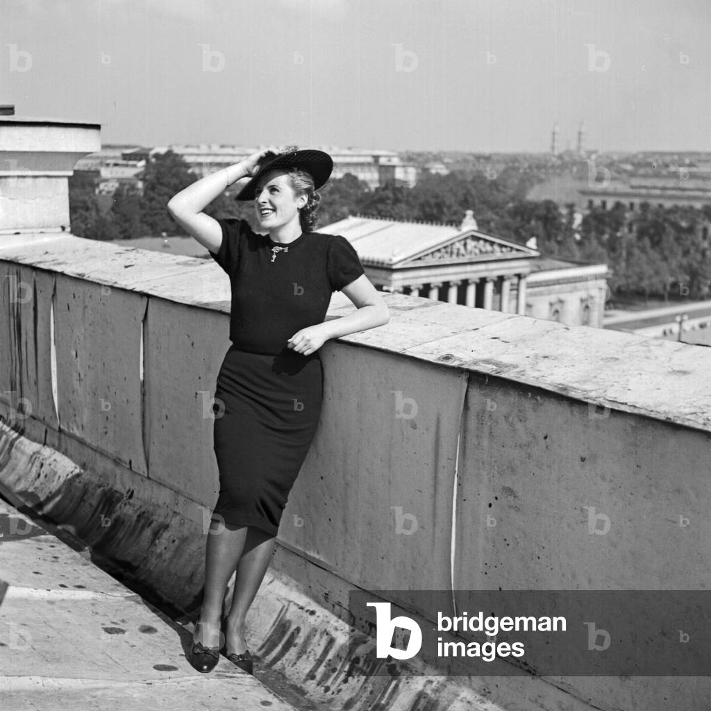 A woman leaning on a balustrade at Munich, Germany 1930s (b/w photo)