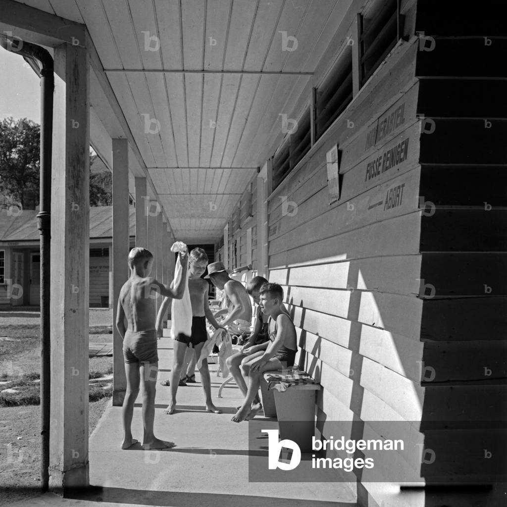 Boys at the locker rooms at the pool of Herrenalb in Black Forest, Germany 1930s (b/w photo)