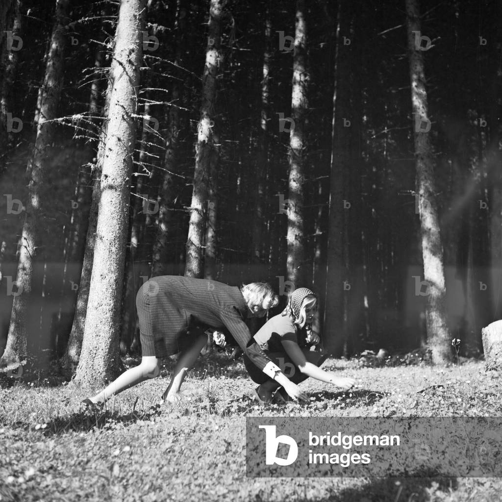 Two young women in a forest at the Wachau area in Austria, Germany 1930s (b/w photo)