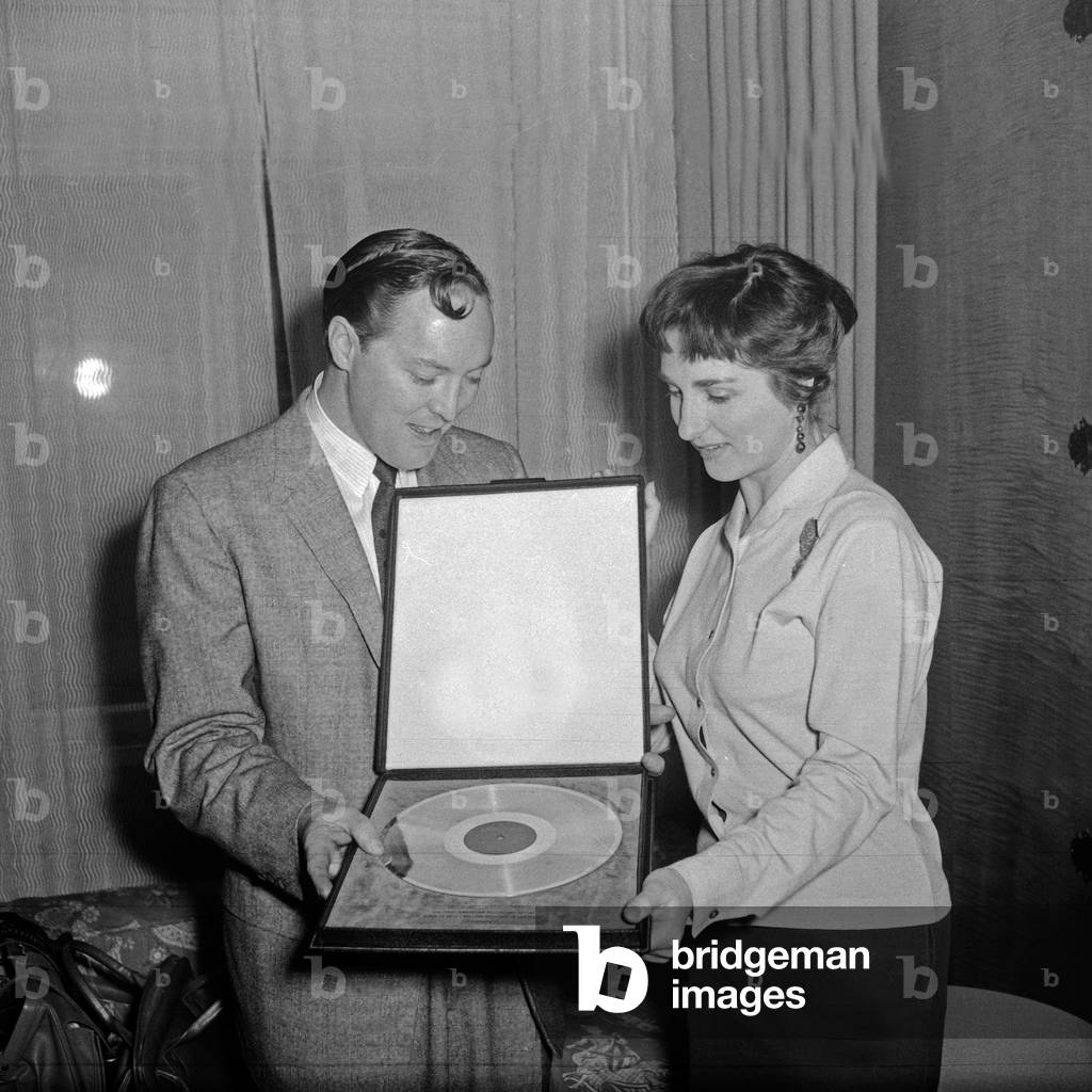 American Rock n Roll singer Bill Haley receiving the golden disk for his song 