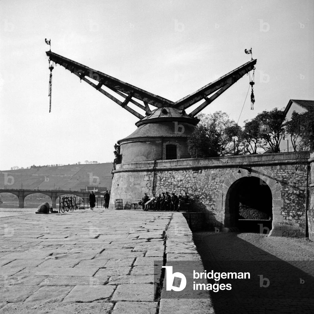 A crane at the shore of Wuerzburg harbor, Germany 1930s (b/w photo)