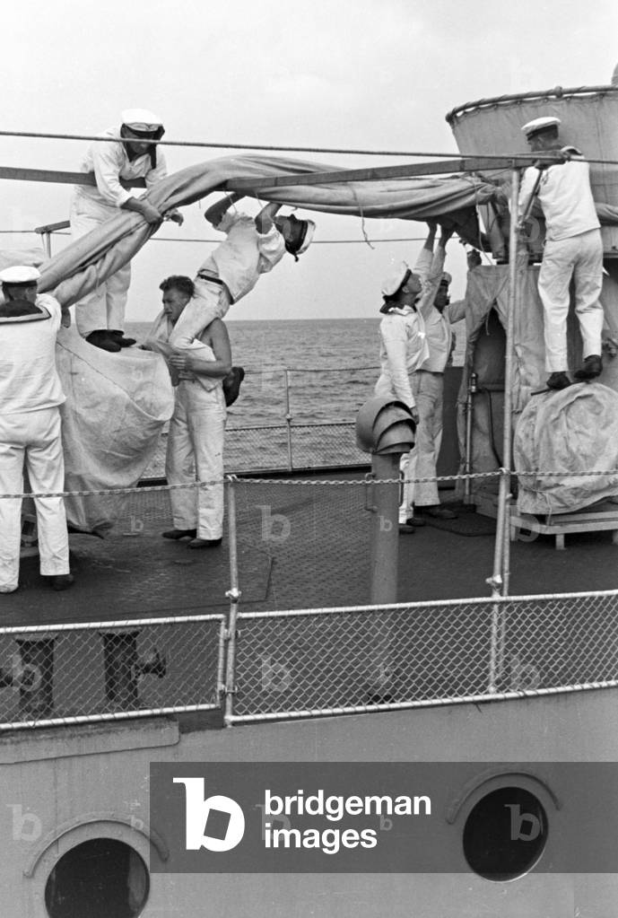 Sailors working on deck of a ship at Usedom harbor at the Baltic Sea, Germany 1930s (b/w photo)