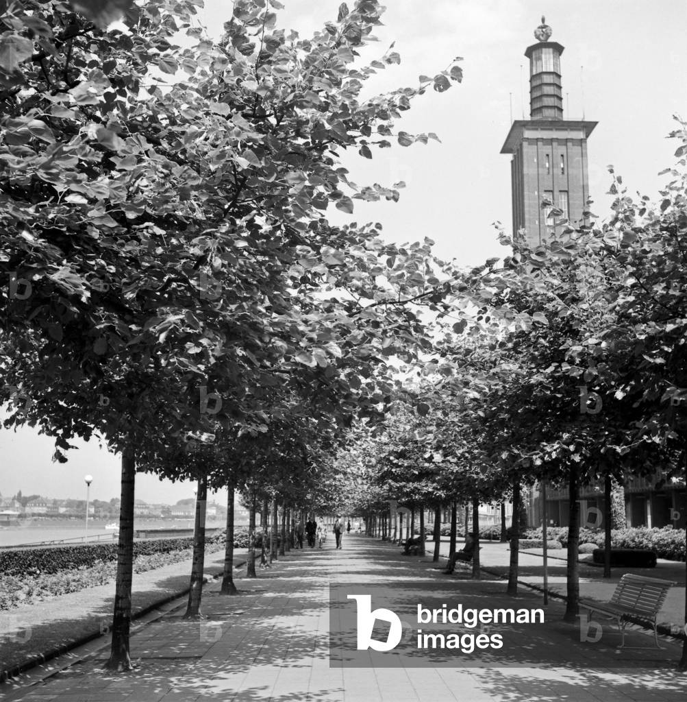 Shore of river Rhine with Cologne fair buildings and tower, 1930s (b/w photo)
