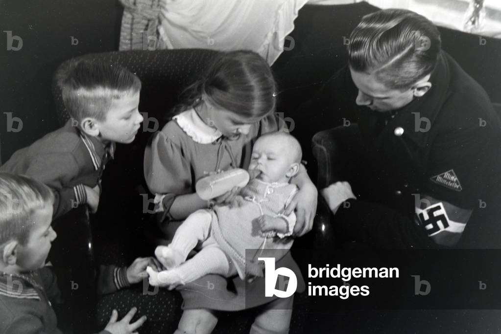 Members of an extended family with the newborn baby, Germany 1930s
