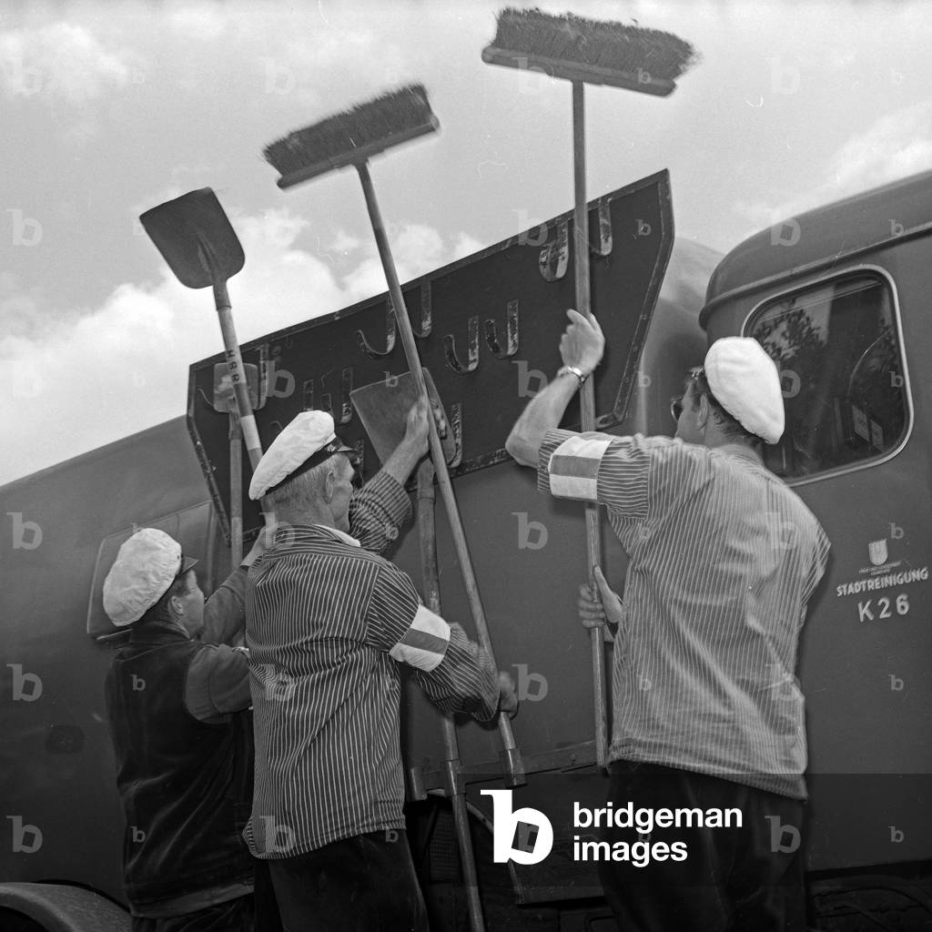 Men of the public street cleaning on the streets of Hamburg, Germany 1960s