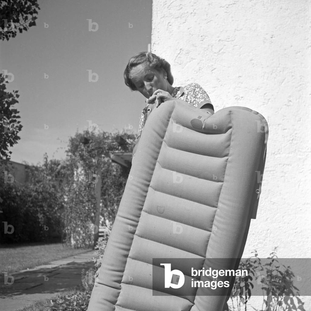 A young woman with an airbed, Germany 1930s (b/w photo)